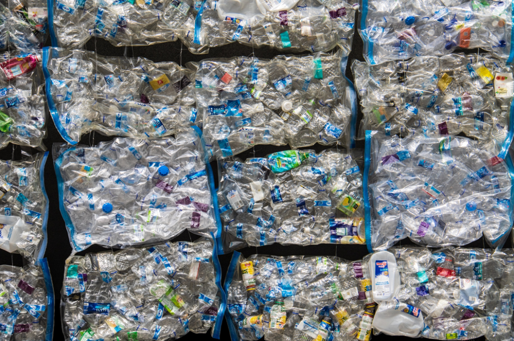Stacked bales of compressed plastic waste. Image credit: Nick Fewings/Unsplash