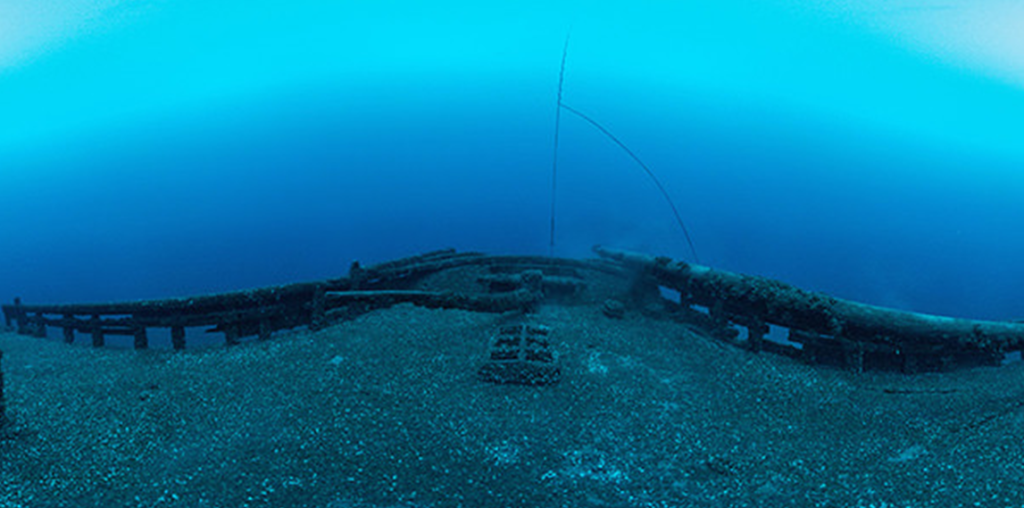Underwater view of the wreck of the schooner Defiance, lost in Thunder Bay in Lake Huron in 1854. View is of the stern of the vessel. Image credit: National Marine Sanctuaries/National Oceanic and Atmospheric Administration