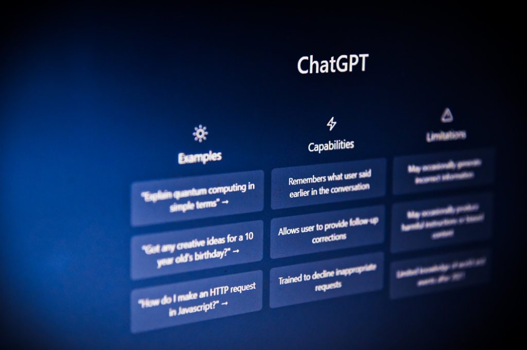 Image of a computer screen showing a ChatGPT interface with example prompts, capabilities, and limitations arrayed in a series of graphic tiles. Image credit: Levart_Photographer/Unsplash