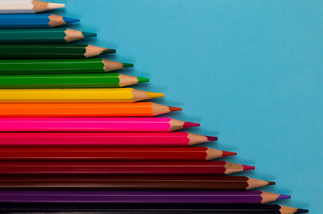 A row of colored pencils, arranged in order of increasing length from image top to bottom (picture has been rotated 90 degrees clockwise from original orientation). Image credit: Tamanna Rumee/Unsplash