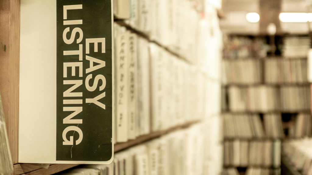 Shelves in a record store or library, with a tab labeled EASY LISTENING projecting out marking the beginning of section. Image credit: Joshua Olsen/Unsplash
